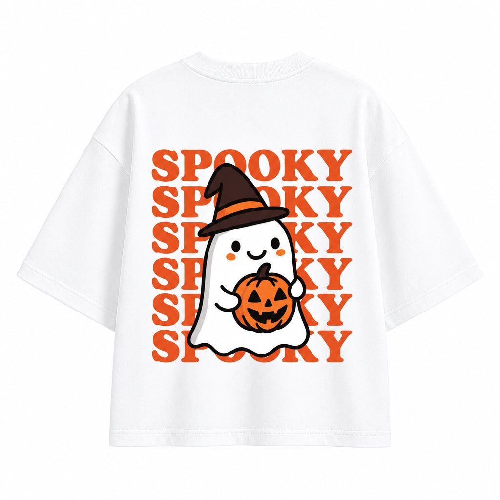 White short-sleeve T-shirt with a Halloween graphic featuring a cartoon ghost holding an orange pumpkin, set against a repeating orange 'SPOOKY' text pattern, shown on a solid gray background.