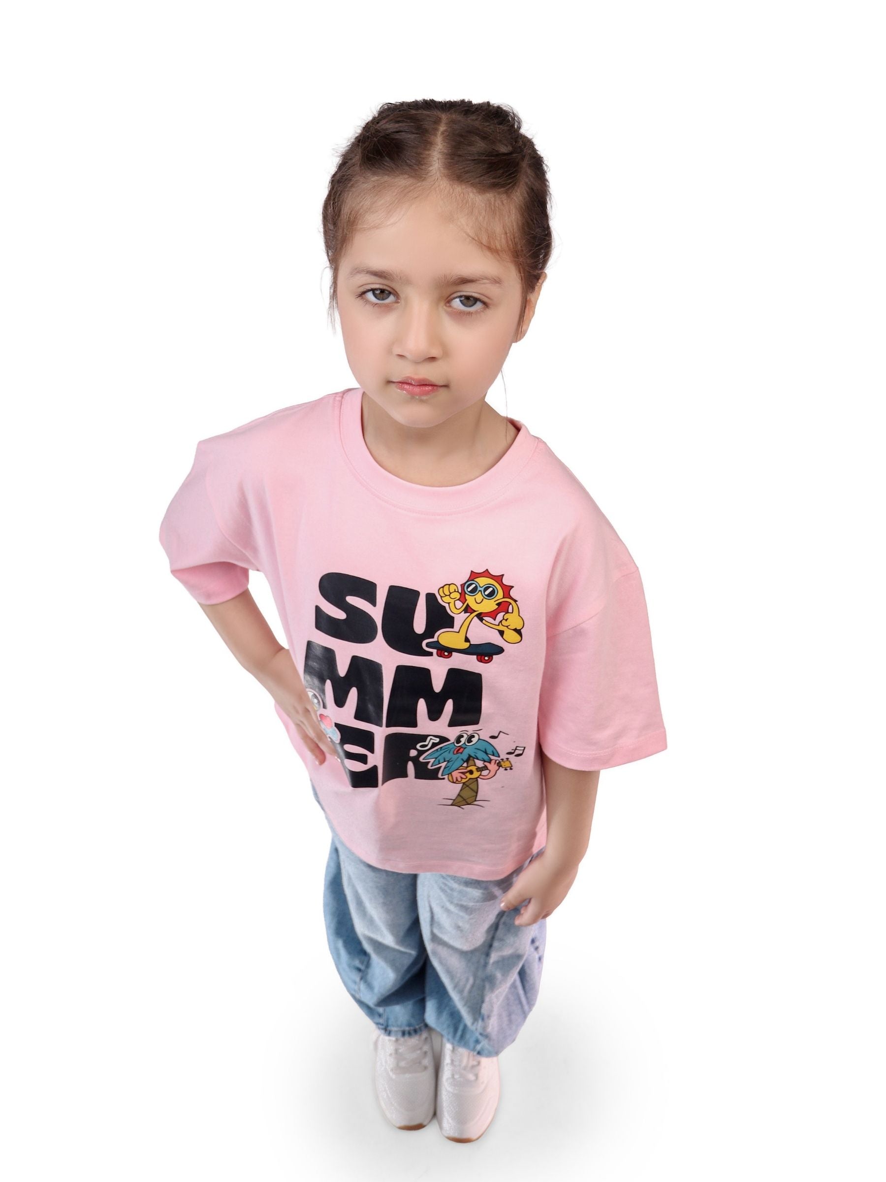 Child wearing a pink t-shirt with cartoon characters and 'SUMMER' text on a white background