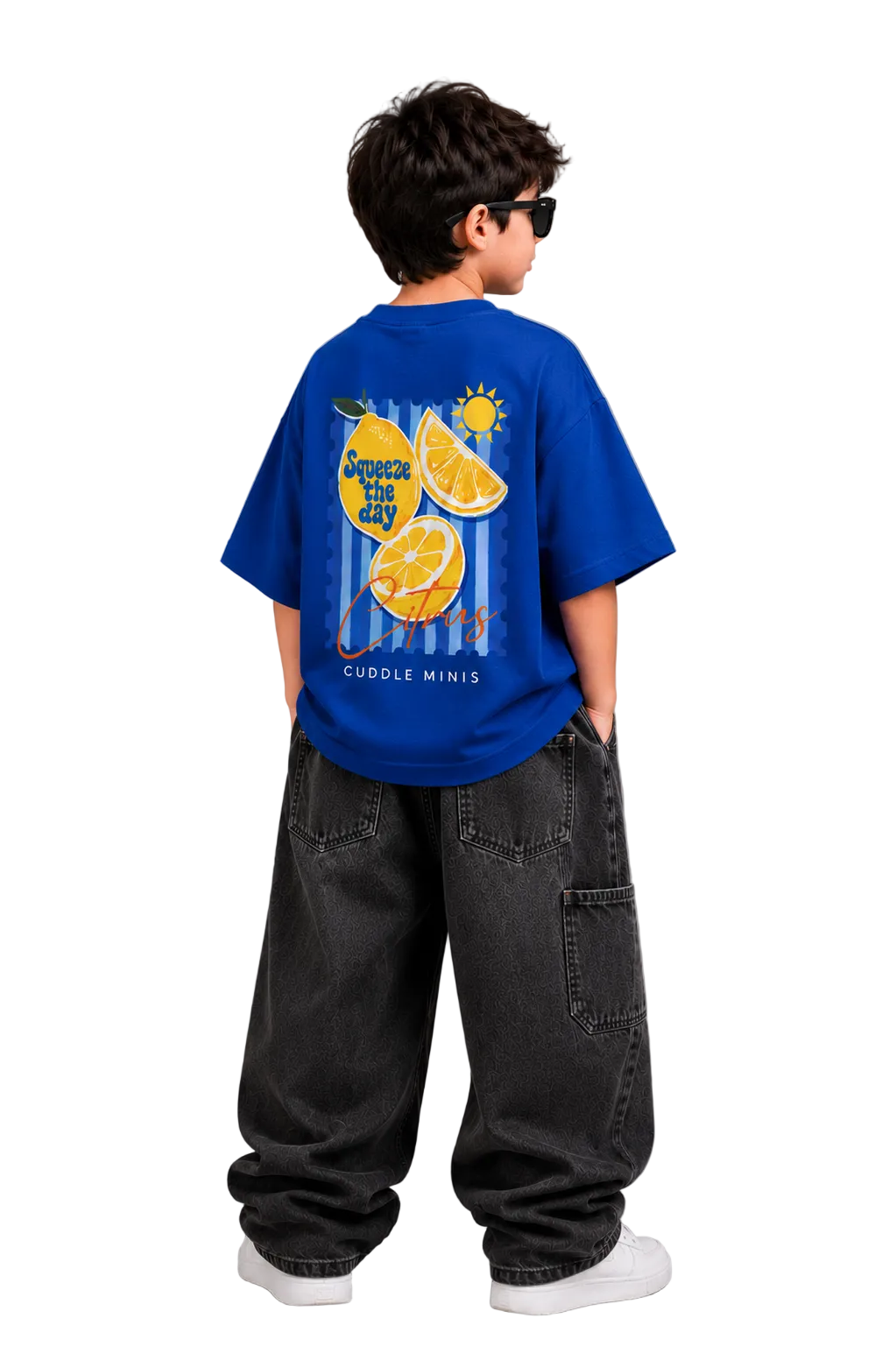 Child wearing a blue t-shirt with a graphic design on the back, standing against a gray background